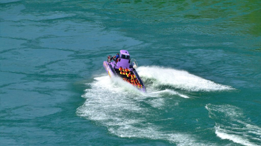 Purple Jet Boat over rapids